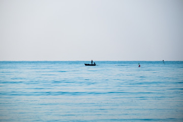 Silhouette fisherman fishing blue sea beautiful natural at morning