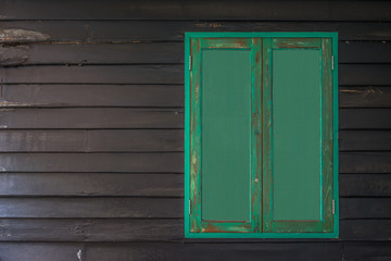 Obraz na płótnie Canvas Green window, wooden background