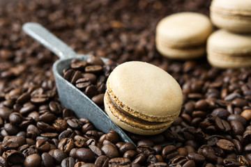 French coffee macaroons and coffee beans background

