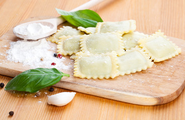 raw ravioli and basil