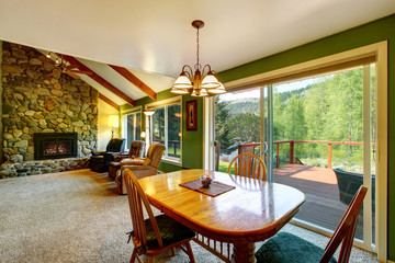 Great living room and dining interior in American country house.