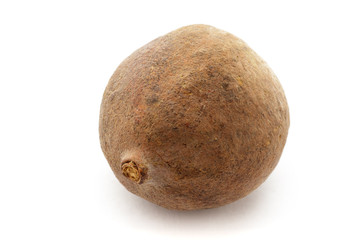 Fototapeta premium Organic dry Bahera or Beleric (Terminalia bellirica) seed. Isolated on white background. Macro close up. Top view.