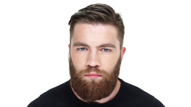 Attractive funny tricky man looking at camera and smiling