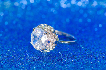 Jewellery ring against blue background