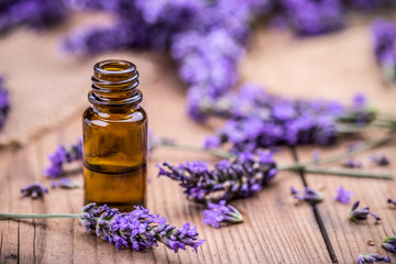 Fototapeta na wymiar Herbal oil and lavender flowers