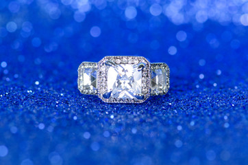 Jewellery ring against blue background