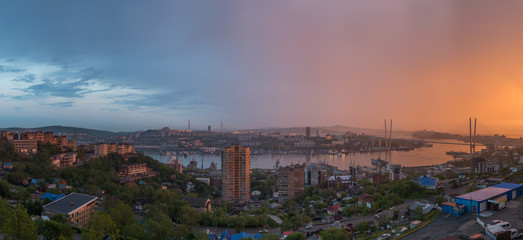 Vladivostok cityscape, sunset view. Panorama from east to west.