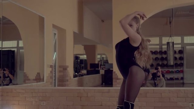 Young beautiful girl dancing on the dance floor