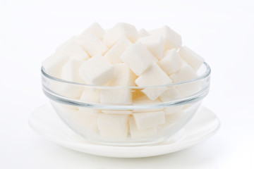 sugar cubes in transparent bowl