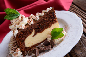 Piece of chocolate cheesecake with whipped cream