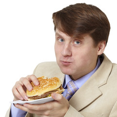Young businessman is the dinner isolated on white background