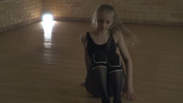 Young girl dancing on the dance floor rehearsal