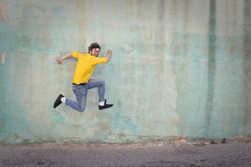 Obraz na płótnie Canvas Happy jumping man