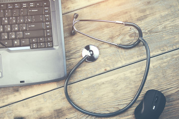 A medical stethoscope and notebook