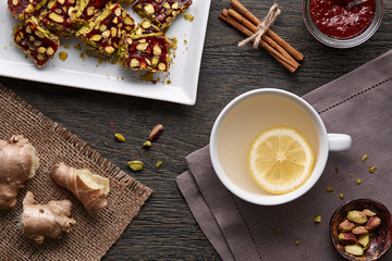 Cup of ginger tea with lemon and turkish delight
