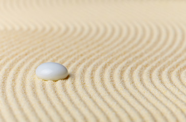 Fototapeta na wymiar Composition on Zen garden - sand, and glass drop