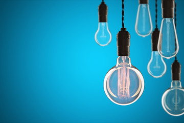 Idea and leadership concept Vintage incandescent Edison bulbs on