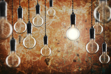 Idea and leadership concept Vintage incandescent Edison bulbs on