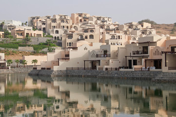 Naklejka premium Arabian homes overlooking a pond in the UAE