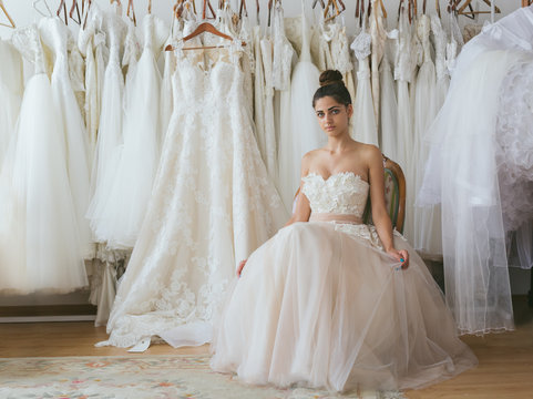 Bride Wearing Wedding Dress In Tailor Shop