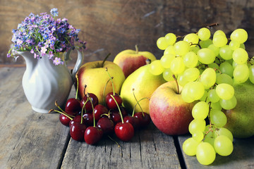 fresh raw fruit on wooden background