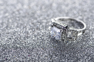 Jewellery ring against shiny background