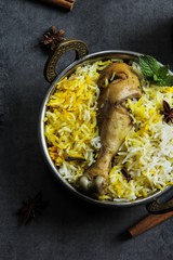 Chicken biryani served in a traditional Kadhai, selective focus