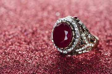 Jewellery ring against shiny background