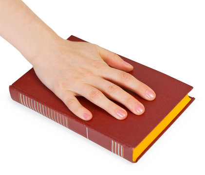 Hand of person reciting the oath on book