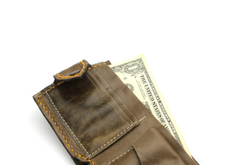 Isolated brown leather wallet with us money banknotes on white b