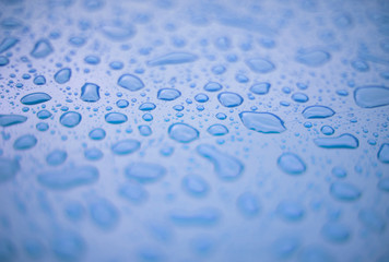 Abstract background - water drops on blue plastic