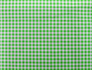 Wooden table covered with tablecloth