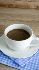 Cup of coffee with on a wooden table,soft focus