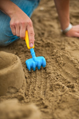 Hand making a sand mold using molds