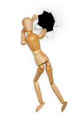 Wooden toy man crawls into hole
