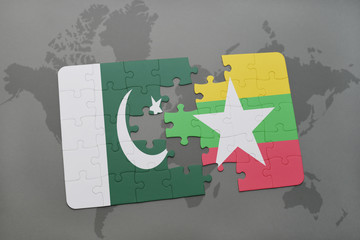 puzzle with the national flag of pakistan and myanmar on a world map background.