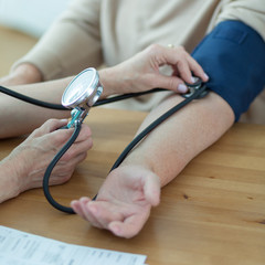 Woman having measured blood pressure