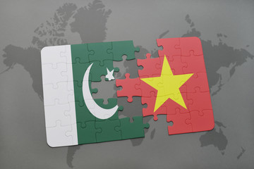 puzzle with the national flag of pakistan and vietnam on a world map background.