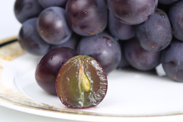The close-up of Peeled  Red Grape on plate