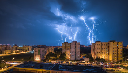 Many Lightnings Over Housing Estate. Night Storm in the City.