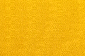 Light yellow ocher background from a textile material. Fabric with natural texture. Backdrop.