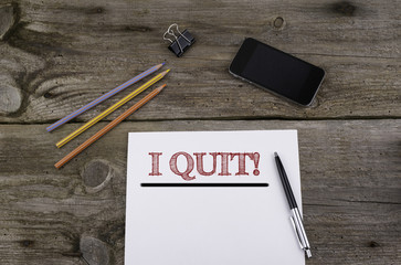 I Quit! Paper background on wood