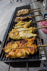 Roast chicken leg on grill