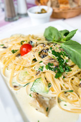 Spaghetti with aubergine and tomato on a the table
