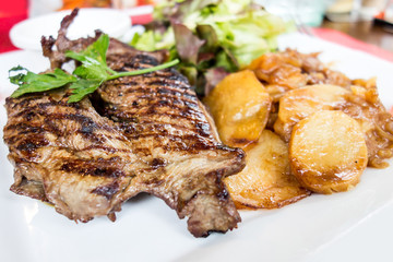 juicy steak beef meat with tomato and potatoes