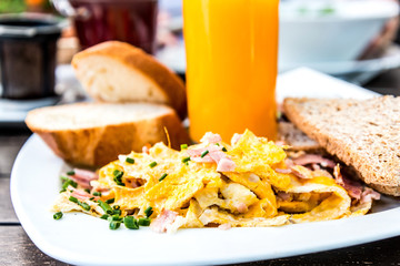 Breakfast with orange juice and fresh fruits on table