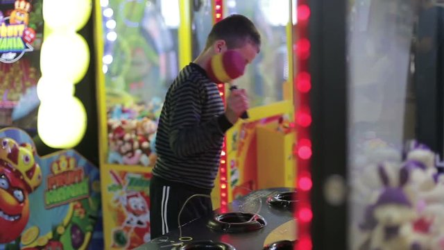 A boy playing a game on the game simulator