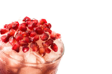 Red cocktail with pomegranate and ice isolated on white background

