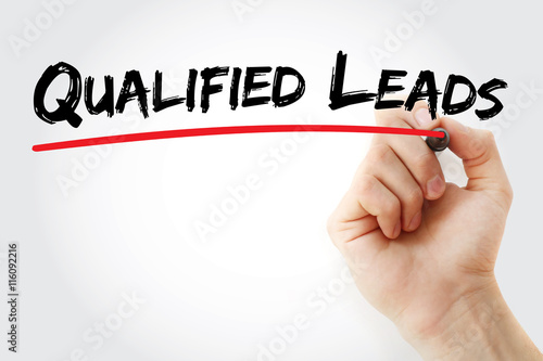 Hand writing Qualified Leads with marker, concept background