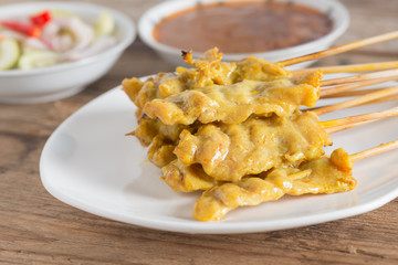 Grilled pork satay with peanut sauce and sour sauce.